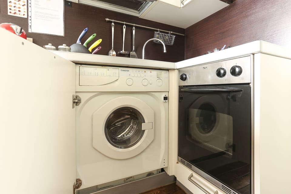 Apartment, 1 Bedroom | Private kitchen | Full-size fridge, stovetop, electric kettle, cookware/dishes/utensils