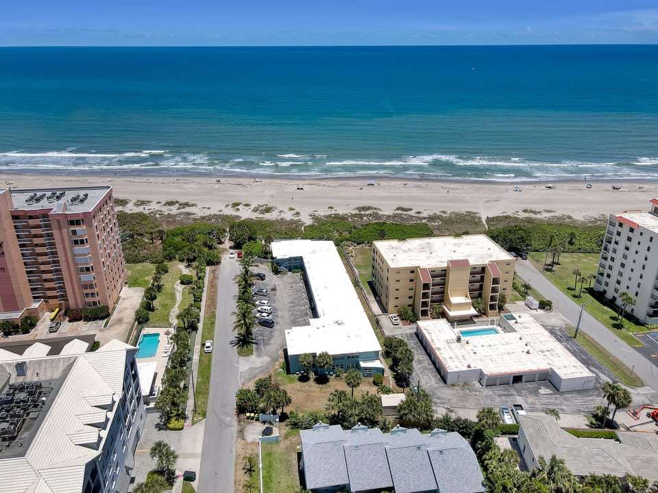 Our place.  Small, 2 story Horseshoe shaped building, directly on the beach!