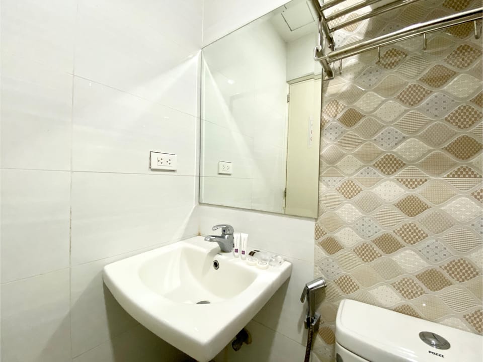 Shower, slippers, bidet, towels