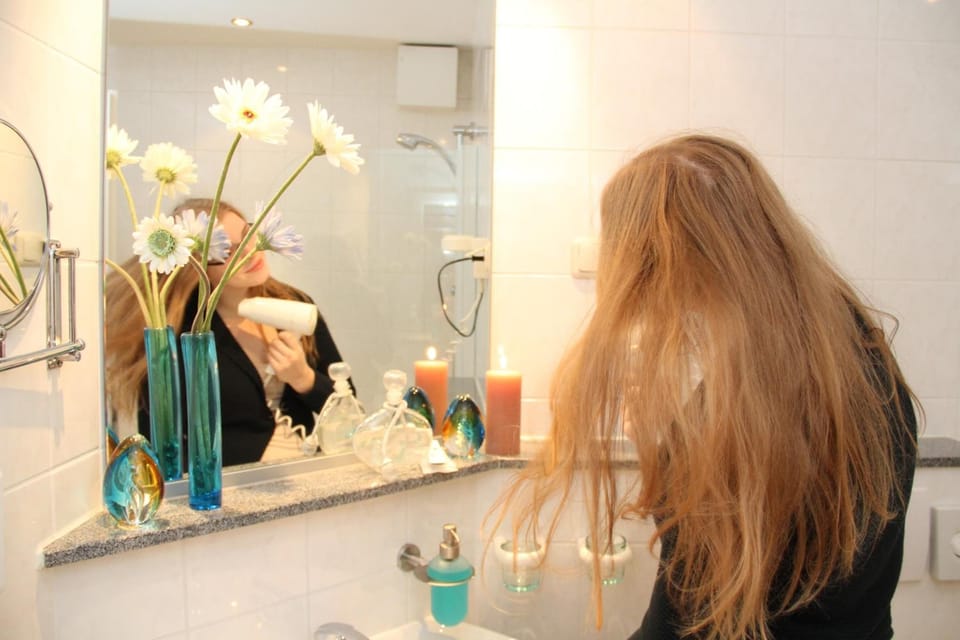 Shower, hair dryer, towels