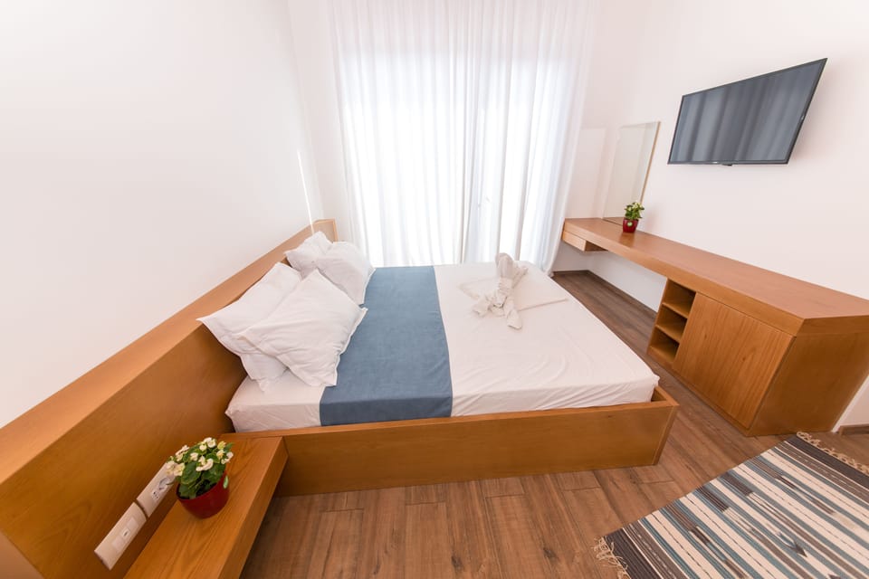 Family Room, Balcony, Sea View | Minibar, in-room safe, desk, soundproofing