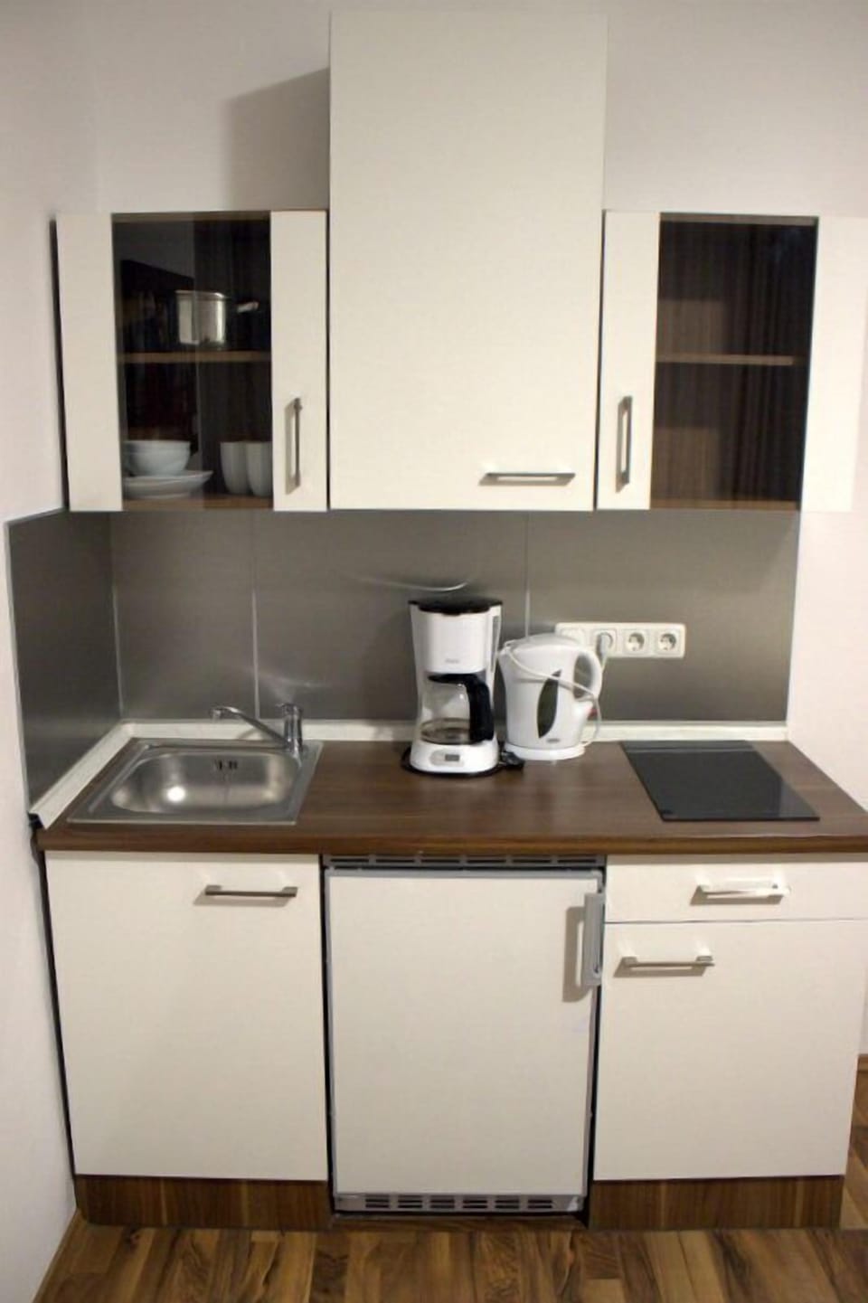 Fridge, stovetop, electric kettle, cookware/dishes/utensils