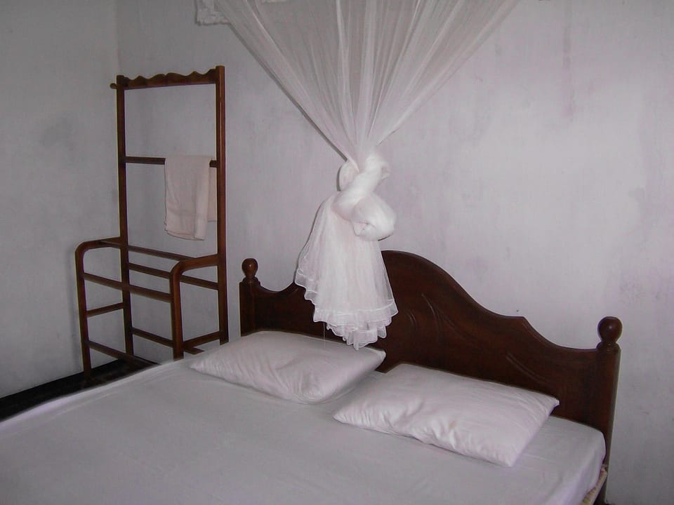 Economy Double Room, 1 Queen Bed, Garden View | 2 bedrooms, free WiFi