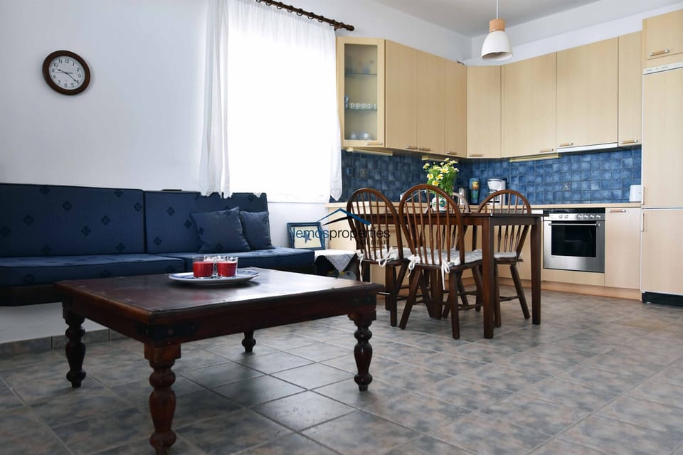 The living room, dining area and kitchen