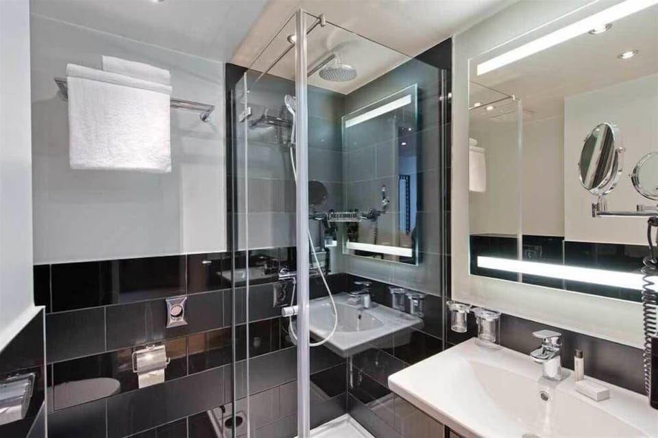 Shower, rainfall showerhead, bidet, towels