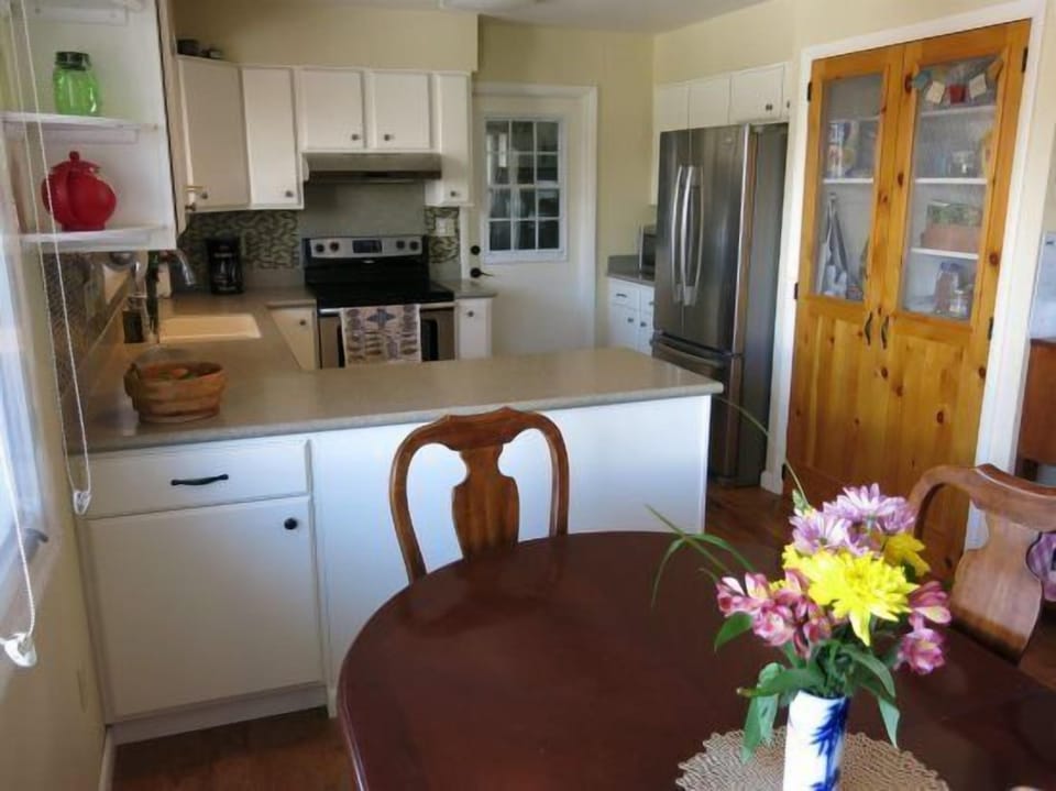 Open kitchen and dining area with large picture window