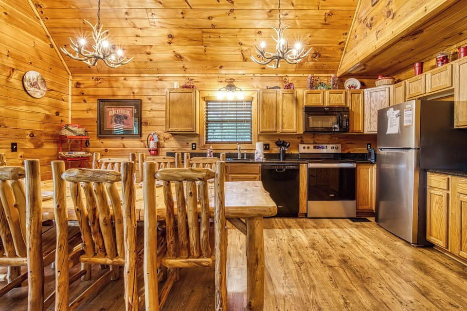 Cabin in Pigeon Forge "Bearadise Mountain Lodge" - Dining table and fully furnished kitchen