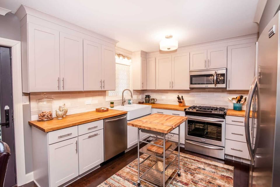 Kitchen with Stainless Appliances, Gas Cooktop, Custom Shaker Cabinets