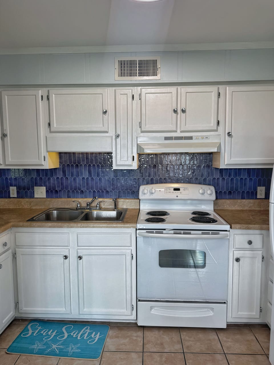 Updated kitchen fully equipped for cooking meals during your stay.