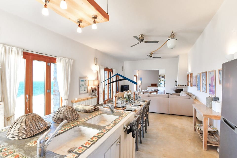 Another view of the living room, dining area and kitchen