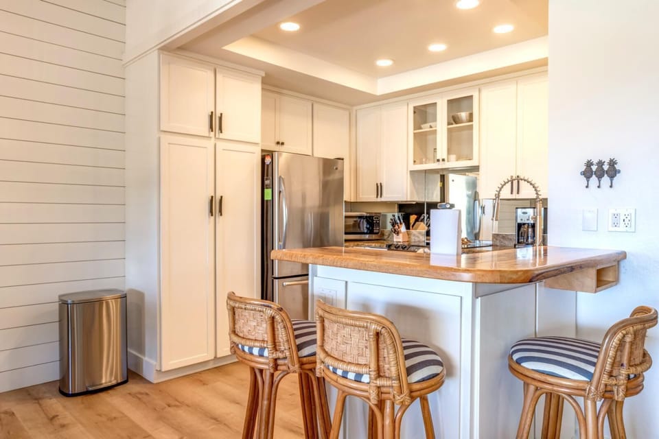 Stools at the island make this a social cooking zone, chop, chat, and cheers all in one place   
