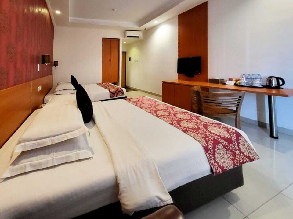 Family Room | Select Comfort beds, desk, laptop workspace, blackout drapes