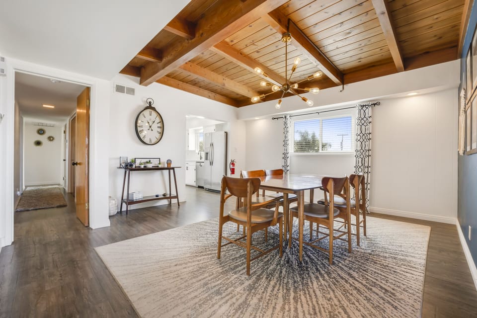 Dining area with view down hall that leads to bedrooms