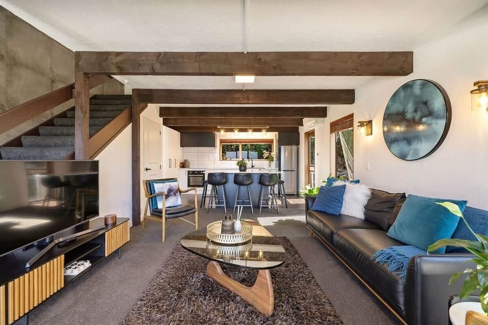 Stylish living and dining area at Walk to Town 39B Alpine Chalet Lomond Crescent Queenstown