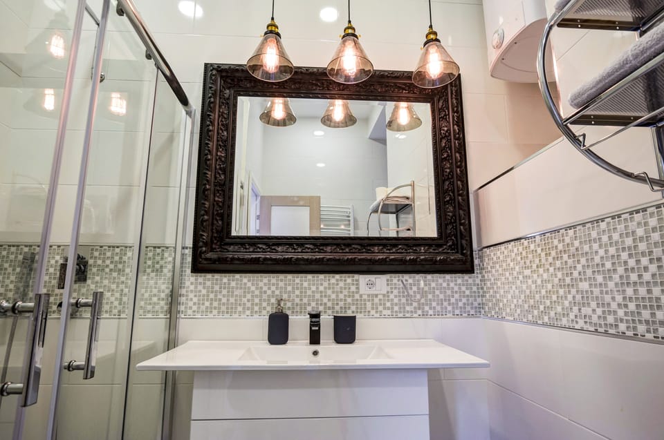 Family Apartment, 1 King Bed, Garden View | Bathroom | Shower, free toiletries, hair dryer, towels