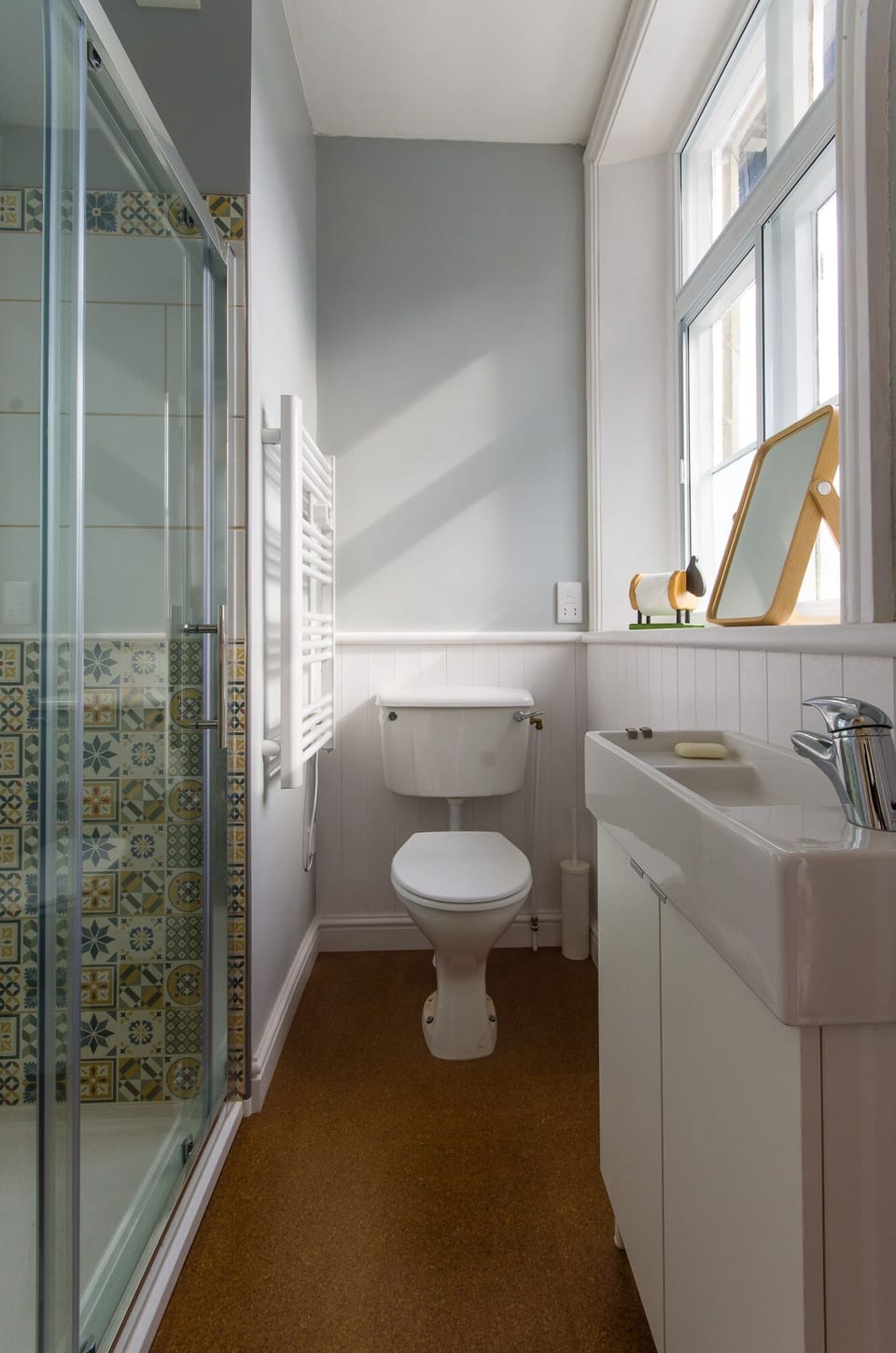 The ground floor bathroom has shower, sink and toilet