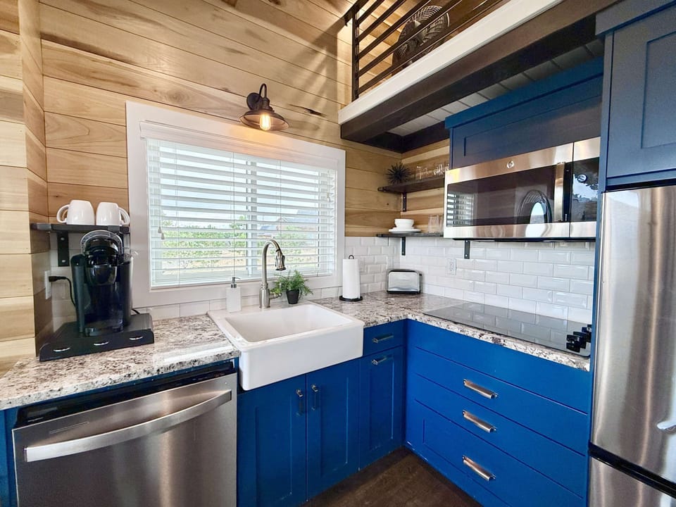 With a farmhouse sink, full-size fridge, stove top, convection microwave oven and more, you’ll love preparing meals in the kitchen!