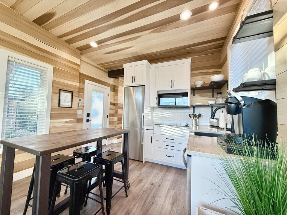 The living and kitchen areas are seamlessly connected by an open floor plan, maximizing the space for you.
