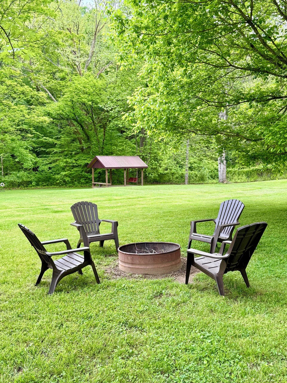Fire Pit with 4 chairs. There is also a gas grill.