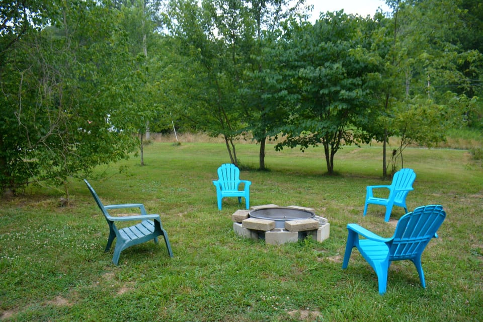 Fire Pit With Four Chairs.  There is also a gas grill.