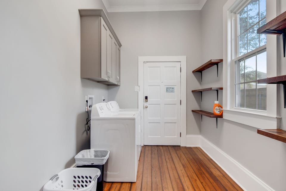 Laundry room with full washer & dryer. Laundry detergent provided.