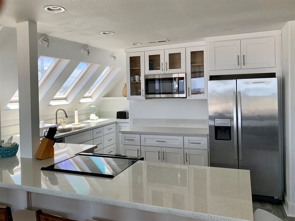Kitchen is loaded with all the appliances, icemaker, coffee