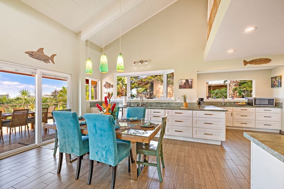 Spacious kitchen and dining area with vibrant decor and modern appliances, perfect for preparing and enjoying meals with family or friends.