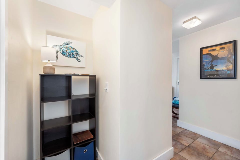 Hallway space thoughtfully designed with convenient storage and coastal accents.
