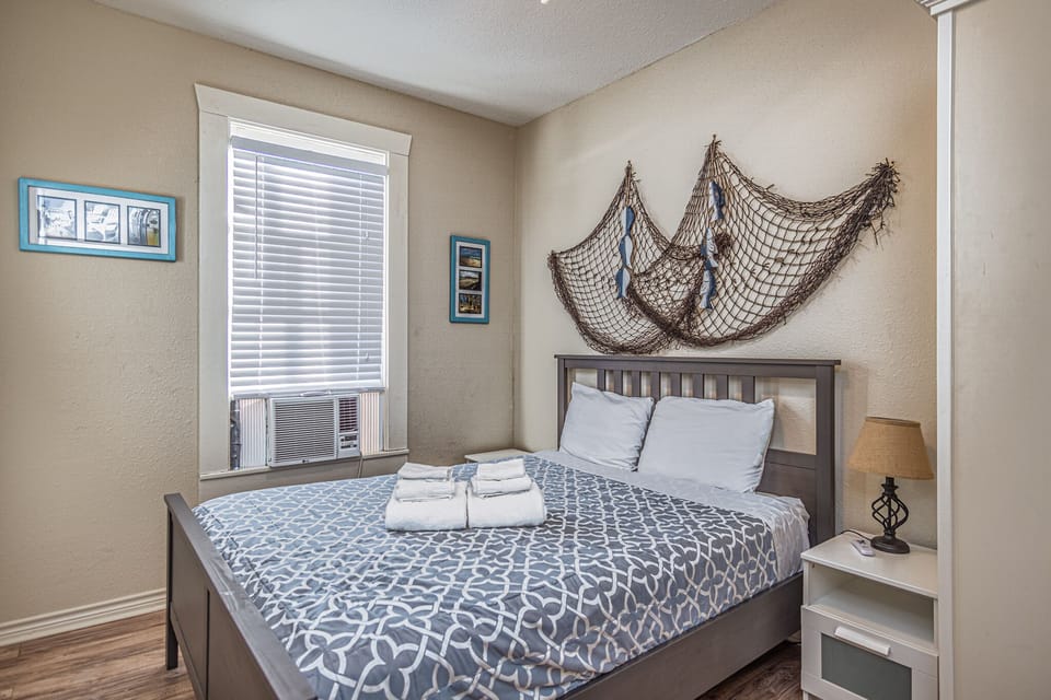 Primary bedroom has comfy Queen size bed to sink into after a long day