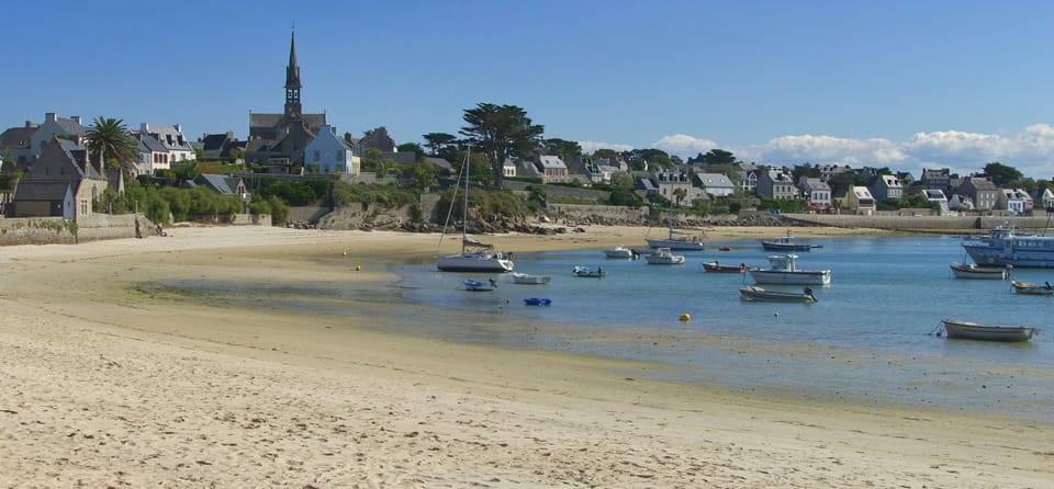Idyllic sandy beach dotted with boats