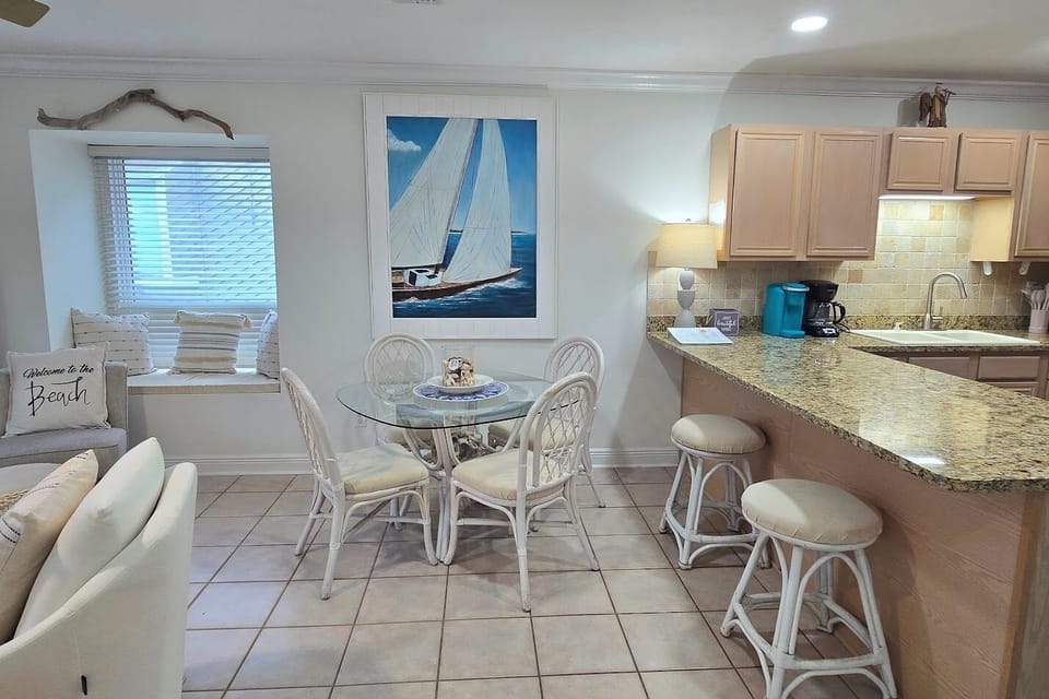 Dining table for four plus large bar area with seating for additional two
