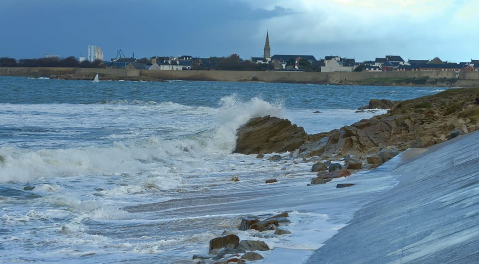 Waves crashing against the rugged shoreline