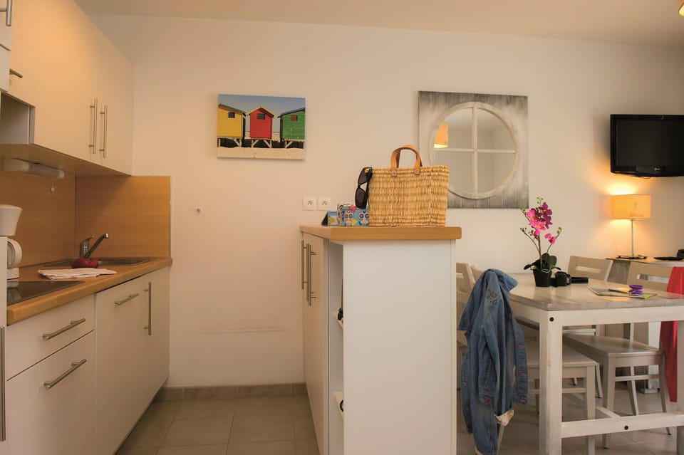 The living area is bright and charming, perfect for your vacation.