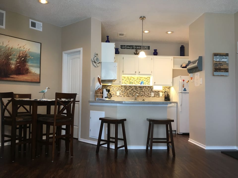 Open kitchen flowing into dining area and living area