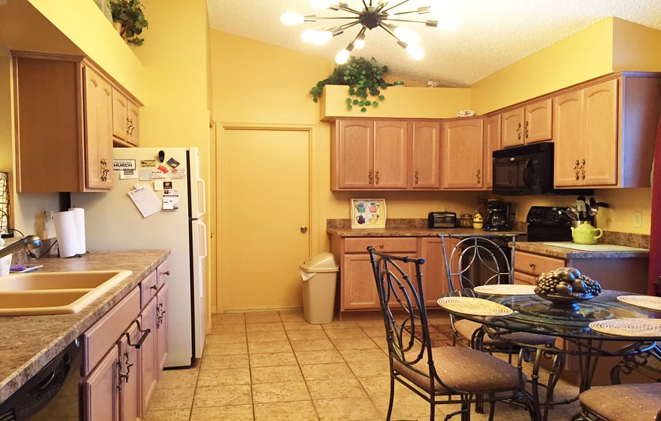 Spacious eat-in kitchen. Door leads to garage.