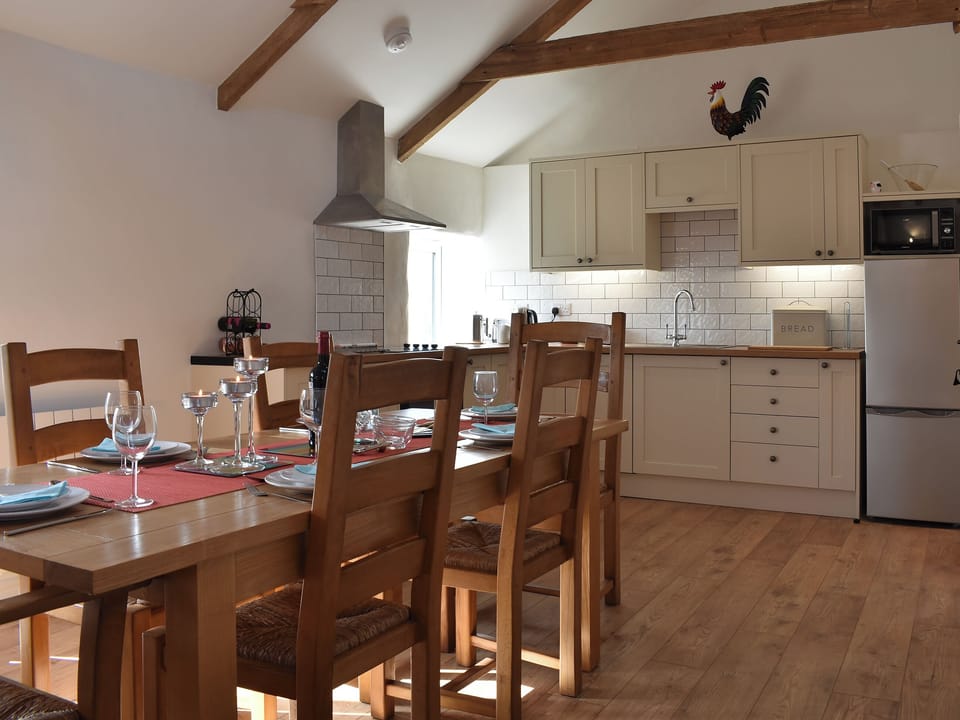 Dining area and adjacent kitchen | Bull Pen - Morwenna Barns, Mount Hawke, near St Agnes