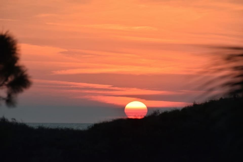 Watch the Gulf light change from your back deck — no filter needed, this view is real every single evening.