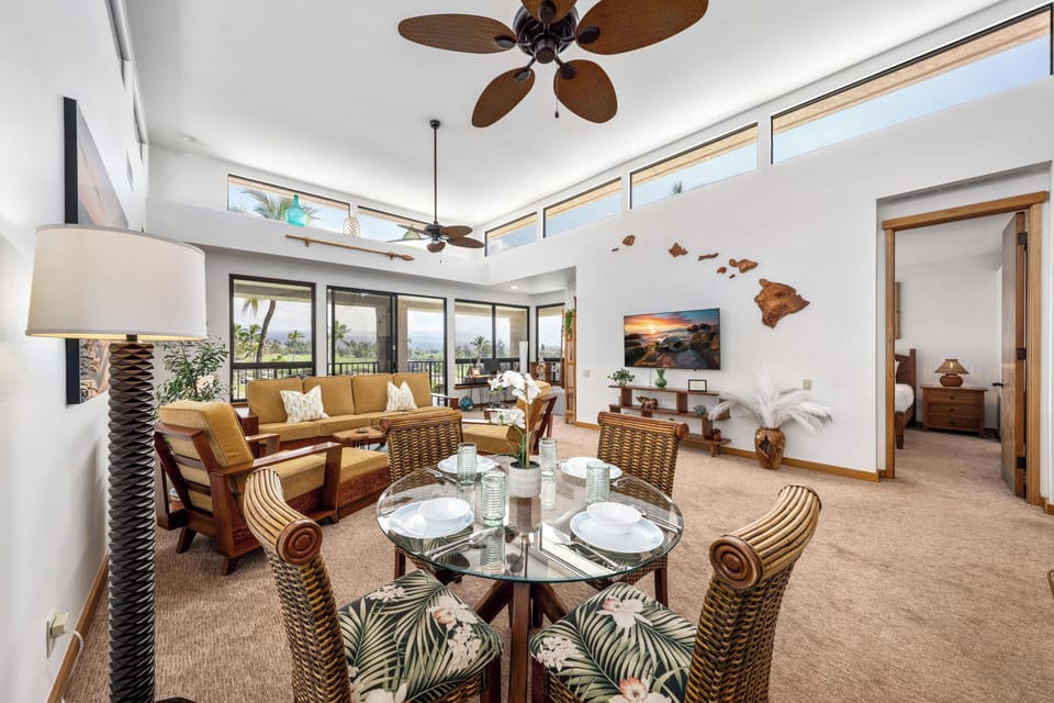 Unwind in your open-plan living space where tropical breezes flow through windows and Hawaiian décor creates the perfect island getaway atmosphere.
