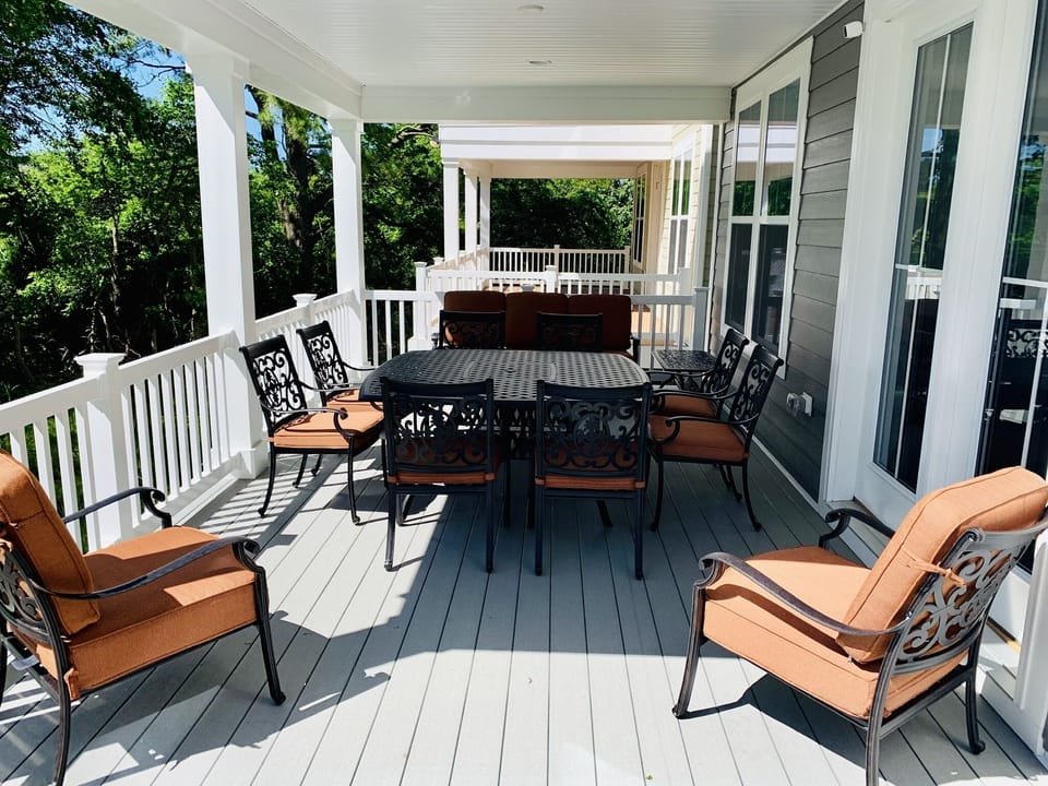 Beautiful porch furniture with seating for thirteen. Weber grill also included.