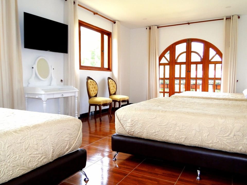 Family Room, Multiple Beds, Garden View | Desk, free WiFi, bed sheets