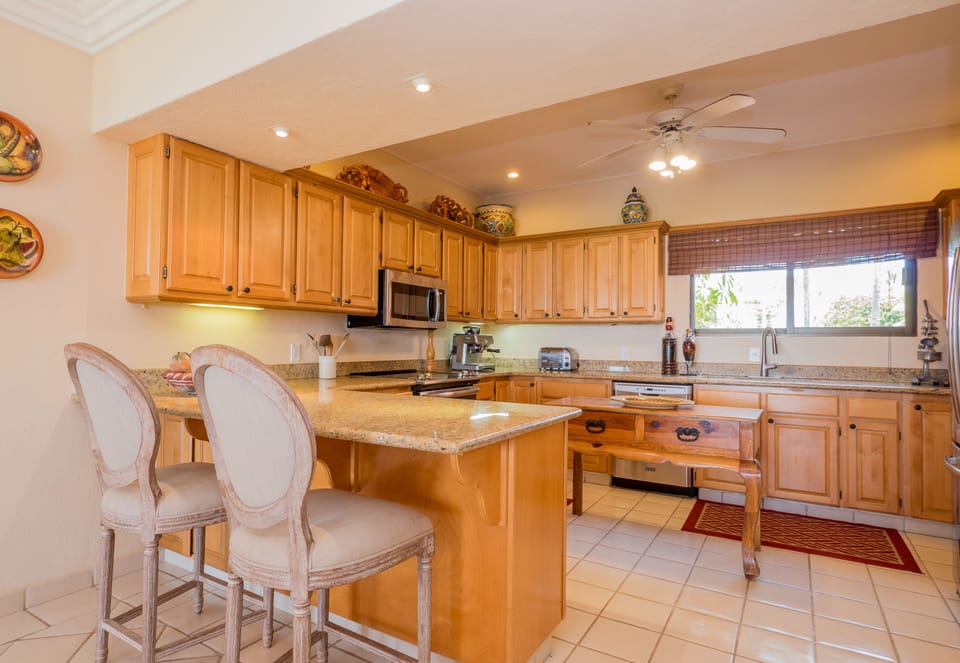 Spacious Kitchen Fully Equipped with an Abundance of Pots, Cooking Utensils....