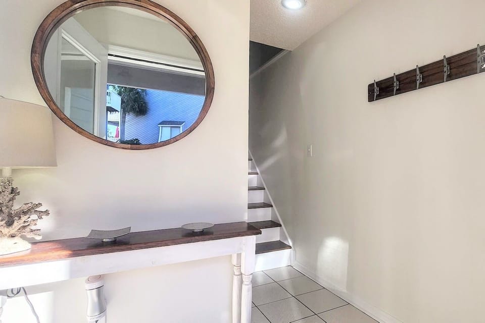 Ground level Foyer has hooks and table for convenience. 