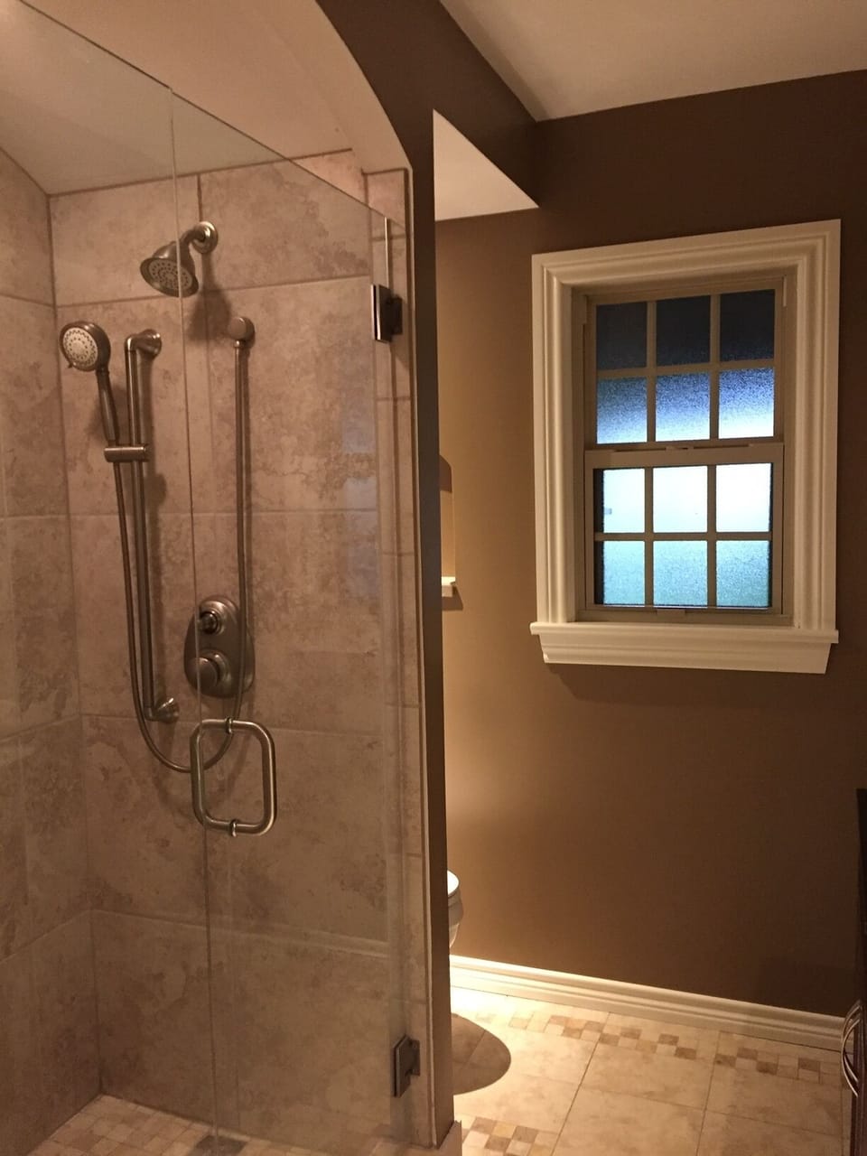 Downstairs Bathroom with walk-in shower and barrel ceiling