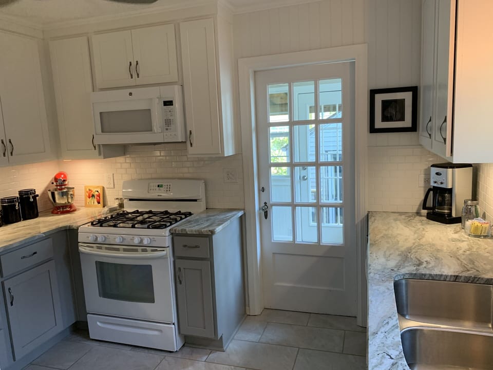 Kitchen with door to laundry room and back door