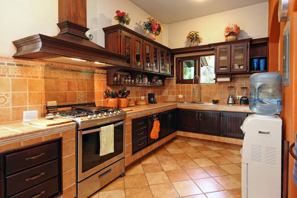 Spacious kitchen with adjacent pre-area for savory local food options.