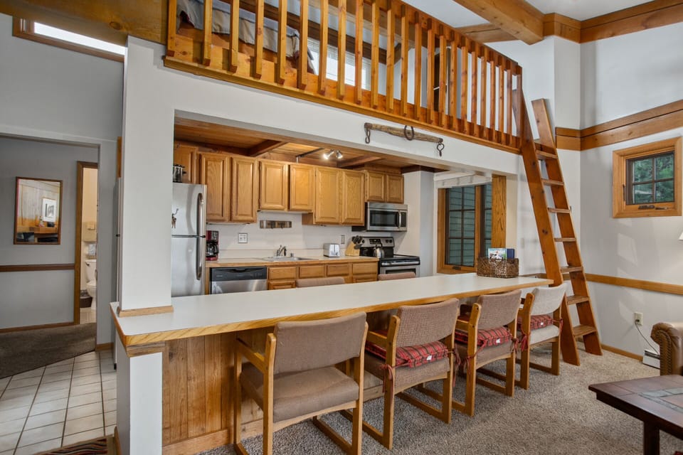 Kitchen pass through and bar - Loft Access using custom wood ladder