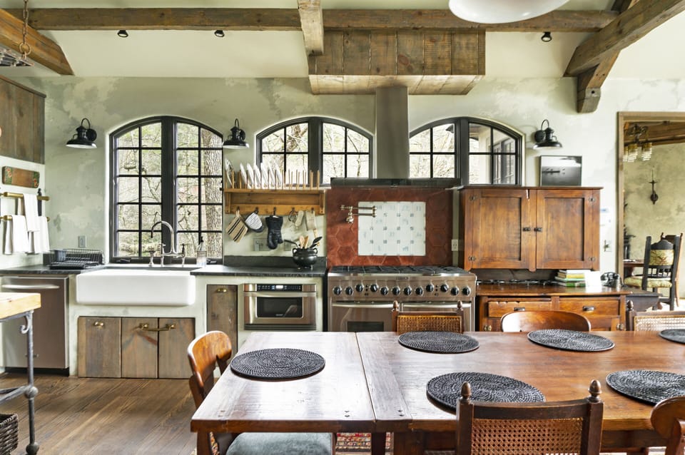 Expansive open kitchen with 8 burner gas stove and double ovens