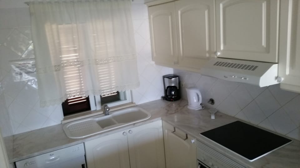 The well-equipped kitchen has all the facilities you would expect in your home.