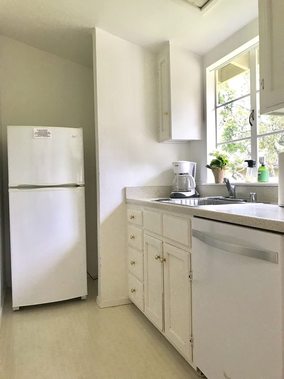 Refrigerator, dishwasher, coffee maker and stainless sink with garbage disposal 