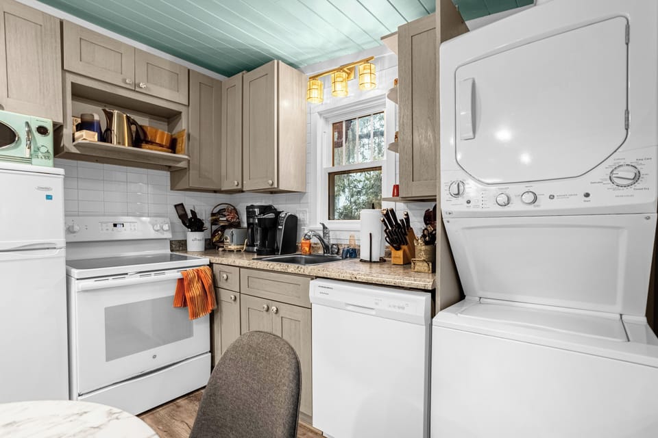 Fully stocked kitchen w/ stove, oven ,frige, microwave, dishwasher & laundry.
